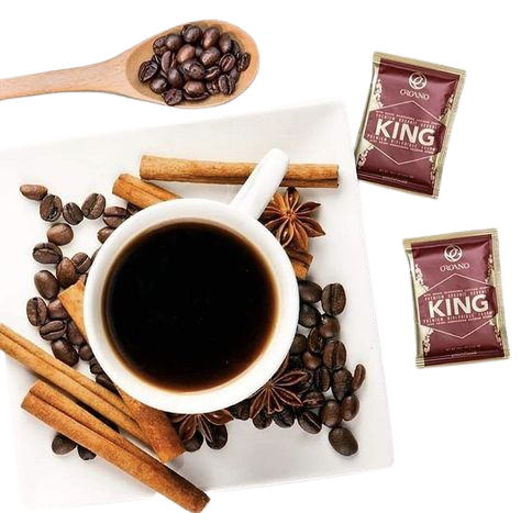 Organo's King Coffee sachets with a cup of brewed coffee